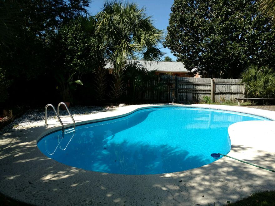 Pool Home in quiet neighborhood in the heart of Destin. Minutes to the Beach and Joe's Bayou. Baltic Brown Granite counters and Stainless appliances. Home has been freshly painted custom colors. Well cared for with tile and laminate flooring throughout. Great home for entertaining with a huge Florida Room open to the living room and kitchen. Yard building for storage. Ready for a new owner to make this one your new ''HOME''.