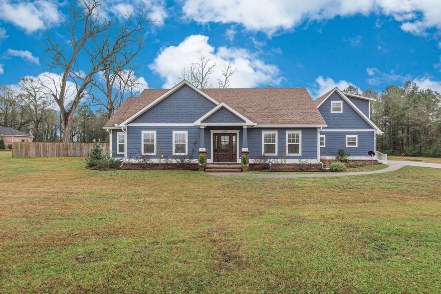 If you're looking for that spectacular country home with the ''WOW FACTOR'', look no further! This custom built Craftsman style showstopper is situated on a 7.5 acre parcel, complete with a massive 24'W x 40'L x 15'H workshop/barn. Located on a paved road in the heart of Baker, amongst other custom built homes, no expense was spared in the construction of this home. The modern farmhouse kitchen is truly the crown jewel of the home. The chef's kitchen showcases 42'' white shaker style cabinets, a subway tiled back splash, beautiful quartz countertops, a 5-burner gas cooktop, 36'' x 9'' farm house sink, self-cleaning True Convection 30'' Double Electric Wall Ovens and a super quiet dishwasher. The cherry on top is the impressive custom built 4 -1/2' x 8'