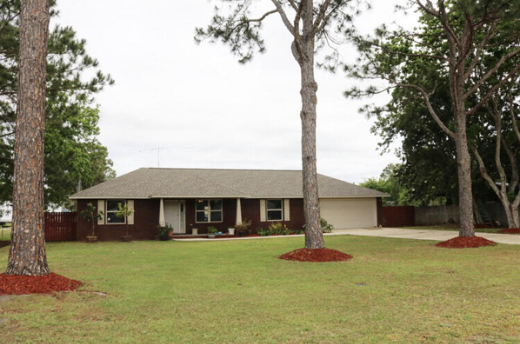 This home has a great open floor plan, den and dining area combined . Brand new hardy plank flooring, wet areas all tile. Newly painted in most areas, Kitchen has stainless steel appliances ,breakfast bar area, updated cabinets with lots of counter space and cabinets. Master has double vanity's , walk in closet and garden tub/shower .Extra room 19x 11.5 can be used as an office/den/home gym etc. Tilt and slide windows throughout, garage is slightly oversized and has an entry way to the back yard. Relax on the newly painted 16x 12 wooden deck and wash the day away. Home also comes with an AS IS workshop /yard building 25/20 with electric hook ups. Home also has a monitored alarm system.