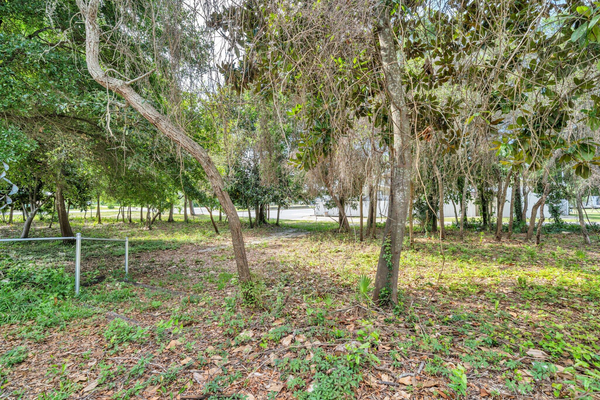 Opportunities abound with this beautiful lot strategically located in the heart of downtown Destin! Convenient to numerous shopping areas, grocery stores, post office, schools, churches, beaches, Harborwalk, and other area attractions. The new Publix just a few blocks away. Here is your opportunity to custom build your own design, or purchase the home next door (also for sale under separate listing) and keep this as additional wooded acreage for your own personal enjoyment. This property may be purchased separately or together with the home listed next door. Not zoned for Short Term Rentals.