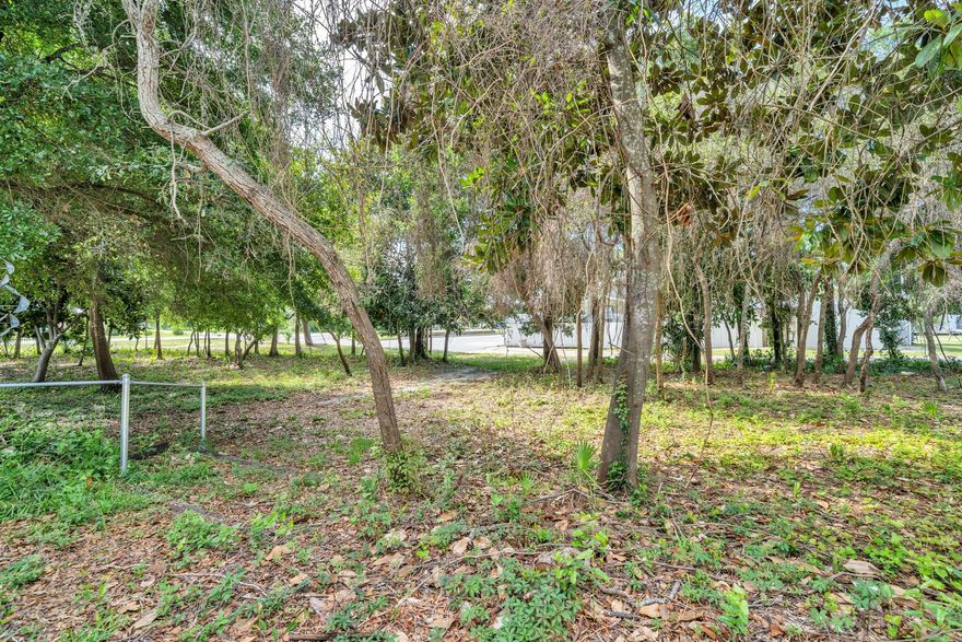 Opportunities abound with this beautiful lot strategically located in the heart of downtown Destin!  Convenient to numerous shopping areas, grocery stores, post office, schools, churches, beaches, Harborwalk, and other area attractions. The new Publix just a few blocks away.  Here is your opportunity to custom build your own design, or purchase the home next door (also for sale under separate listing) and keep this as additional wooded acreage for your own personal enjoyment.  This property may be purchased separately or together with the home listed next door. Not zoned for Short Term Rentals.