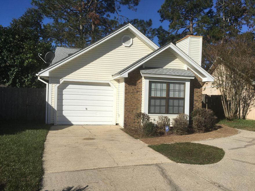 NEW Wood Plank Ceramic Porcelain Tile in all but the bedrooms where there is NEW carpet!  Freshly painted with an upgraded Master Bath and ready for new owners!  This centrally located home has not only a fireplace, but also Frigidaire Side by side stainless steal refrigerator with ice maker in the kitchen and a nice large back yard.  Easy access to Eglin, Hurlburt or the beaches!