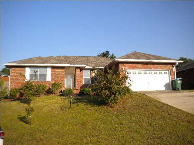 Available 06/13/2014.....and possibly earlier. South of I-10 convenience to bases, beaches & shopping. Spacious 4/2 home that lives large. Kitchen features and eat in area, Oak finish cabinets, plenty of counter and cabinet space and adjacent large laundry. There is a formal dining/office area. A cozy fireplace for those cool Florida winters and large bedrooms. Treyed ceilings and split floor plan. Master bedroom can accommodate large furniture and spacious master bath with walk in closet. 2 car garage, covered back patio and large back yard that is pet friendly. No inside smoking. Pets may be allowed with a $400 non-refundable pet fee.