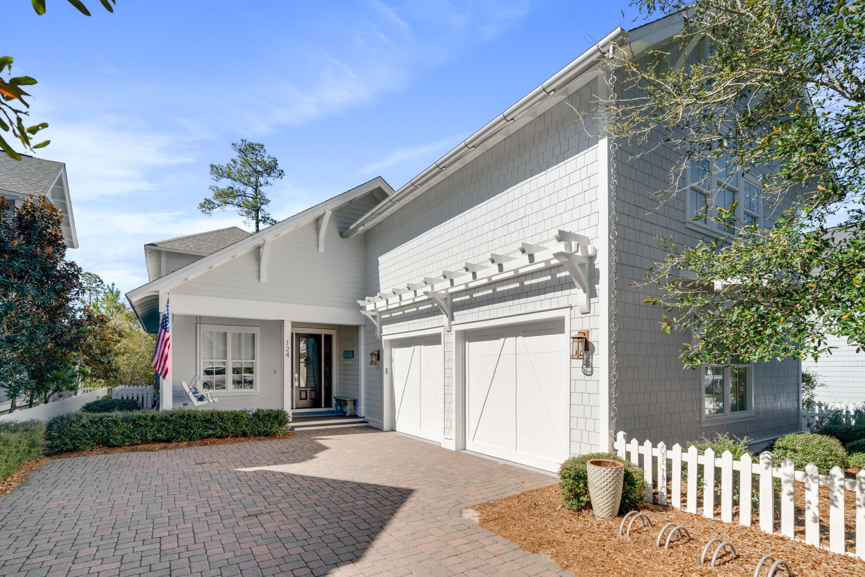 Experience the luxury of being south of 30A in this Nantucket-inspired home within WaterSound. A true coastal retreat with modern elegances can be found in this 5 bedroom, 5.5 bath home that is skillfully-designed with exquisite attention to detail. Whether you're looking for a private retreat or a home for entertainment, the privacy this home offers along the lakeside is unmatched. The oversized screened porches span the entire length of the home on the main level and the upper level, as well, taking full advantage of the lush natural landscaping and views. Entertain outdoors with your summer kitchen including a gas grill with custom hood or take in the sea breezes and serenity as you relax outdoors lakeside on the swinging beds and cozy furnishings