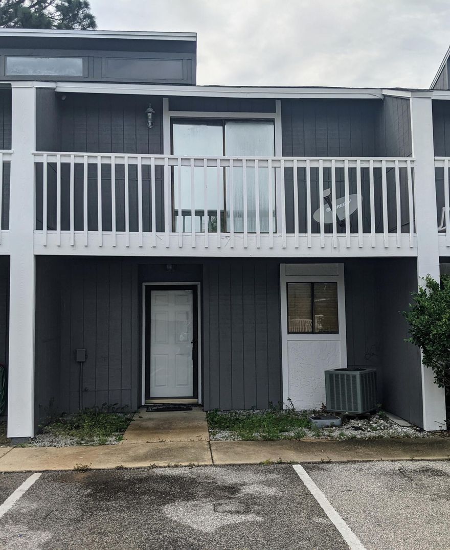 Looking for an investment in the heart of Destin? Seller started and didn't finish renovations on this roomy townhome, but it's got great bones and long-term rental potential. Each large bedroom has its own bathroom, there's newer tile downstairs, a wood-burning fireplace, and the community pool is nearby. Unit comes with 2 assigned parking spaces directly in front. HOA handles exterior maintenance, including roofing and repainting.