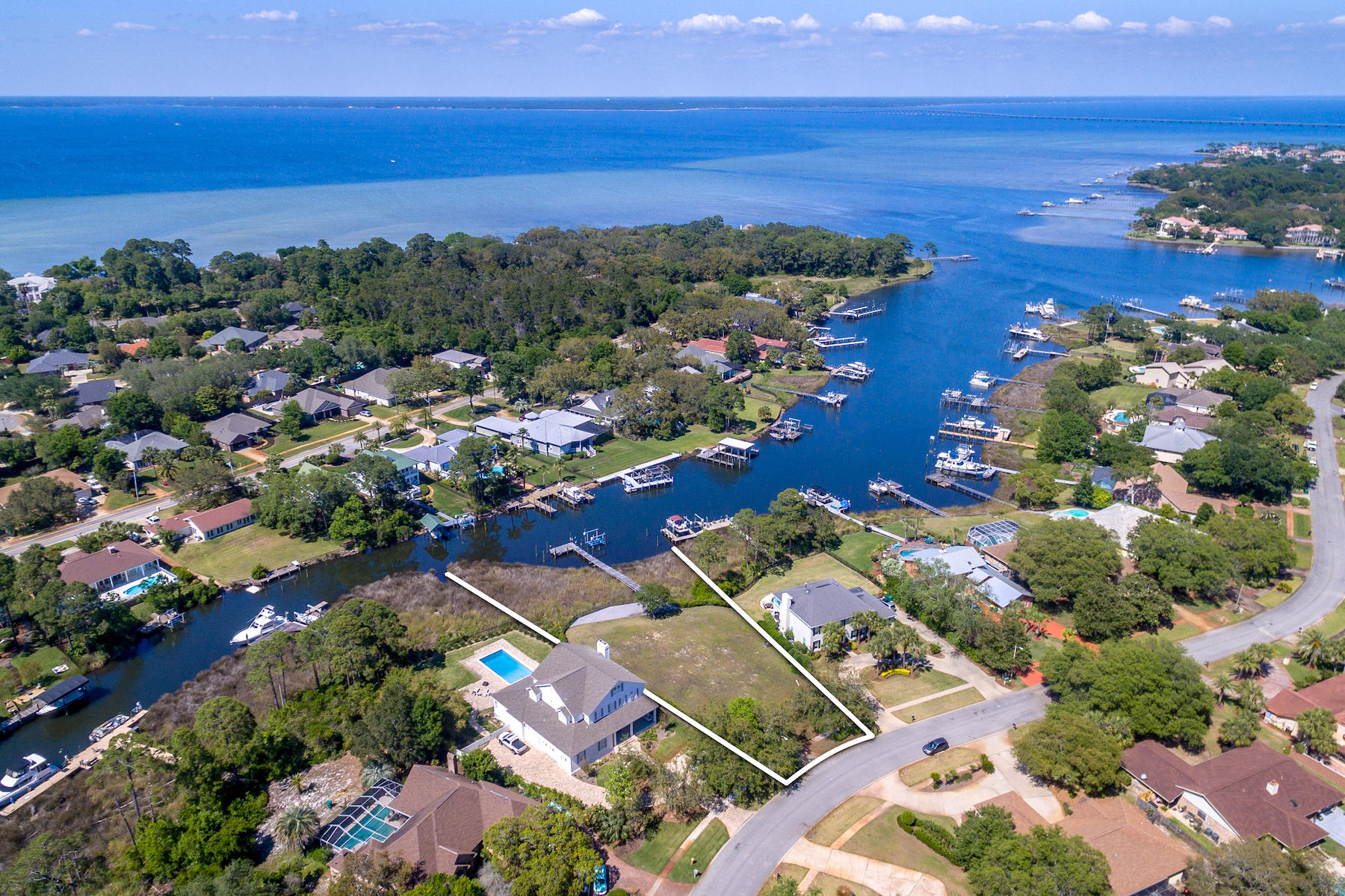 A fabulous deep-water homesite to build your dream home! Nearly 3/4-acre property with 134 feet on protected Indian Bayou and a dock with boat lift. Enjoy all the watersports of the Choctawhatchee Bay as well as the Gulf of Mexico--or opt for golfing at Indian Bayou Golf Course. A wonderful setting for enjoying the Emerald Coast lifestyle!