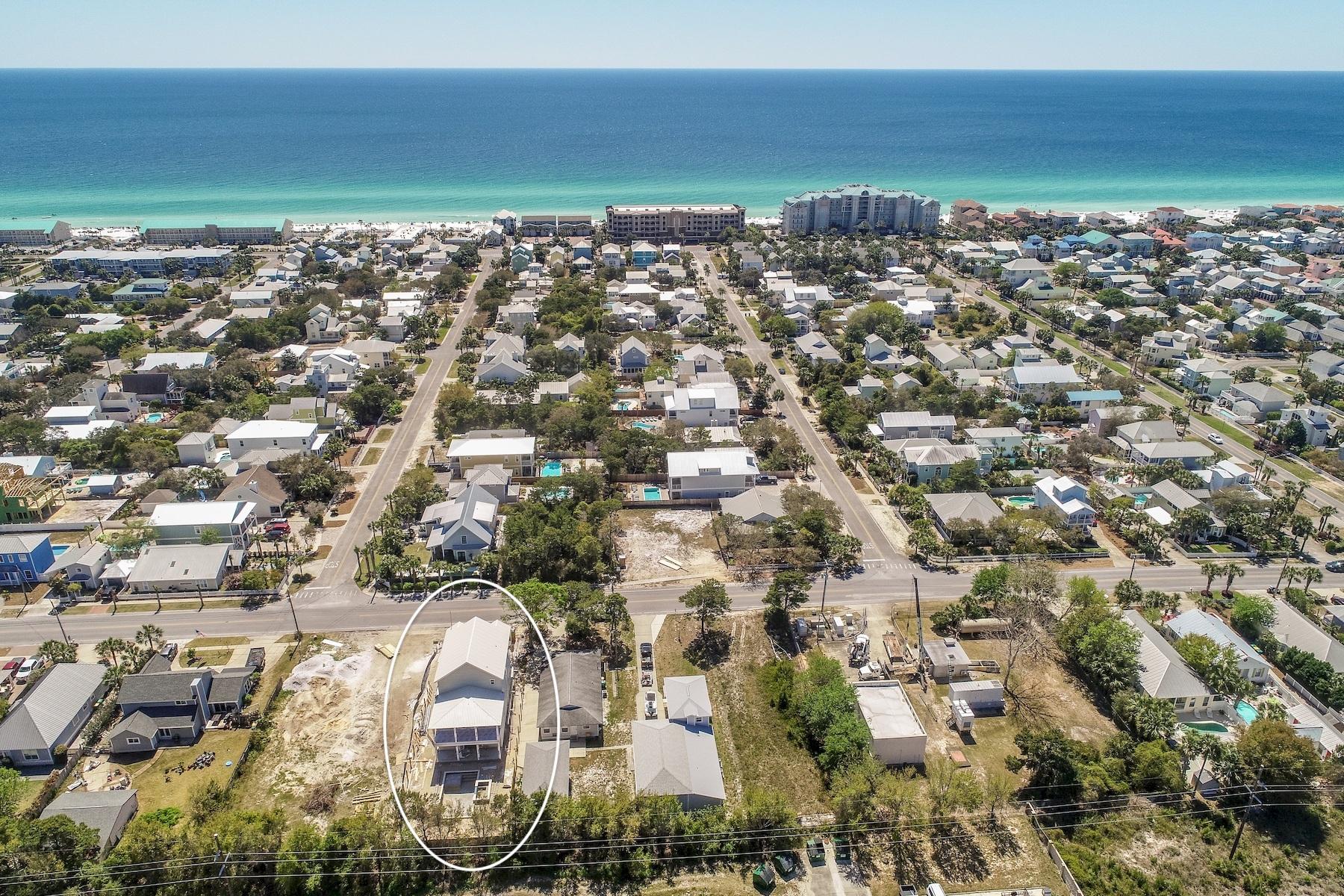 Excellent opportunity to enjoy new construction set amongst the backdrop of the white sand beaches and emerald green waters of the Emerald Coast. This extraordinary eight bedroom home is offered mid construction with ample opportunity to acquire before peak rental season offering +$200,000 in gross annual rental projections with an estimated completion date of early Summer 2019. Thoughtfully designed and masterfully built, this beautiful beachside retreat spans three vertical stories and is highlighted by it's coastal architectural aesthetic utilizing low maintenance, sustainable building products including hardi-plank siding and metal roofing. The open floorplan is beautifully designed with ample room for entertainment anchored