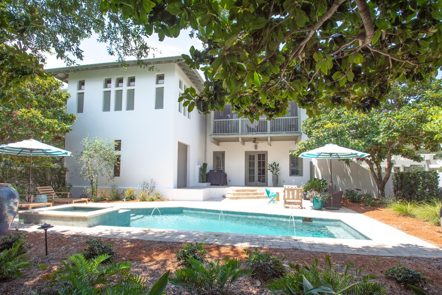 Prominently positioned overlooking East Long Green Park, this Rosemary Beach Retreat boasts broad views from the 2nd floor. A New Orleans style entry from the park through an outdoor covered loggia leads to the spacious private courtyard with a resort size pool and hot tub. Level one hosts three guest bedrooms. A Jack and Jill arranged bath is shared between two of those bedrooms and the 3rd has an ensuite bath. The laundry and an outdoor shower also occupy this level with a light-filled hallway connecting them. The 2nd level hosts the living area and the master bedroom with ensuite bath adjacent to a balcony above the courtyard. This floor also enjoys a multi-windowed office and half bath. The office may convert to a bunk room.