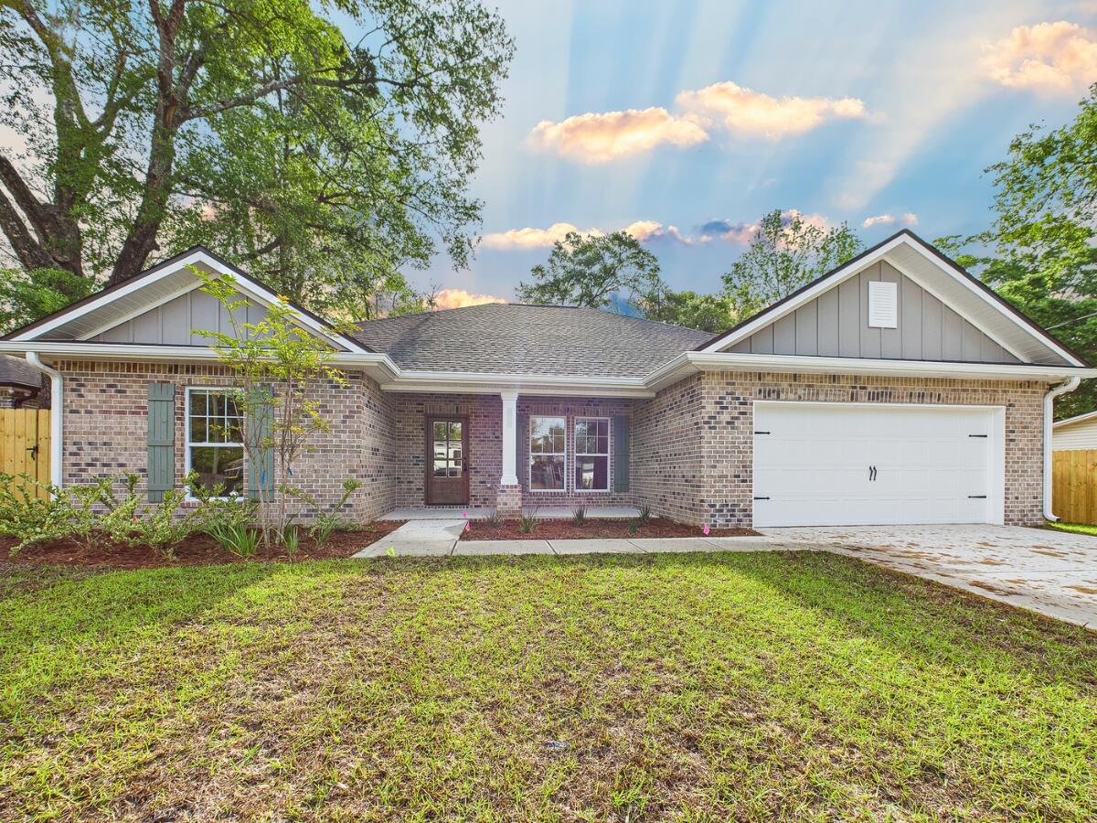 **Est Completion/closing Oct 31. Pics of a similar home.** This 4-bedroom 2-bathroom home is a show stopper. The modern farmhouse features give this home a comfortable quaint feel. The kitchen offers stainless steel appliances, a farmhouse sink overlooking the backyard with a beautiful tile backsplash, floating shelves, and an island. Primary bedroom boasts a cathedral ceiling with wood beams. Bathroom offers a walk-in tile shower, a large freestanding soaking tub, and double vanities. The rest of the home is as thoughtfully designed to accommodate today's modern growing family. Don't miss this opportunity!!