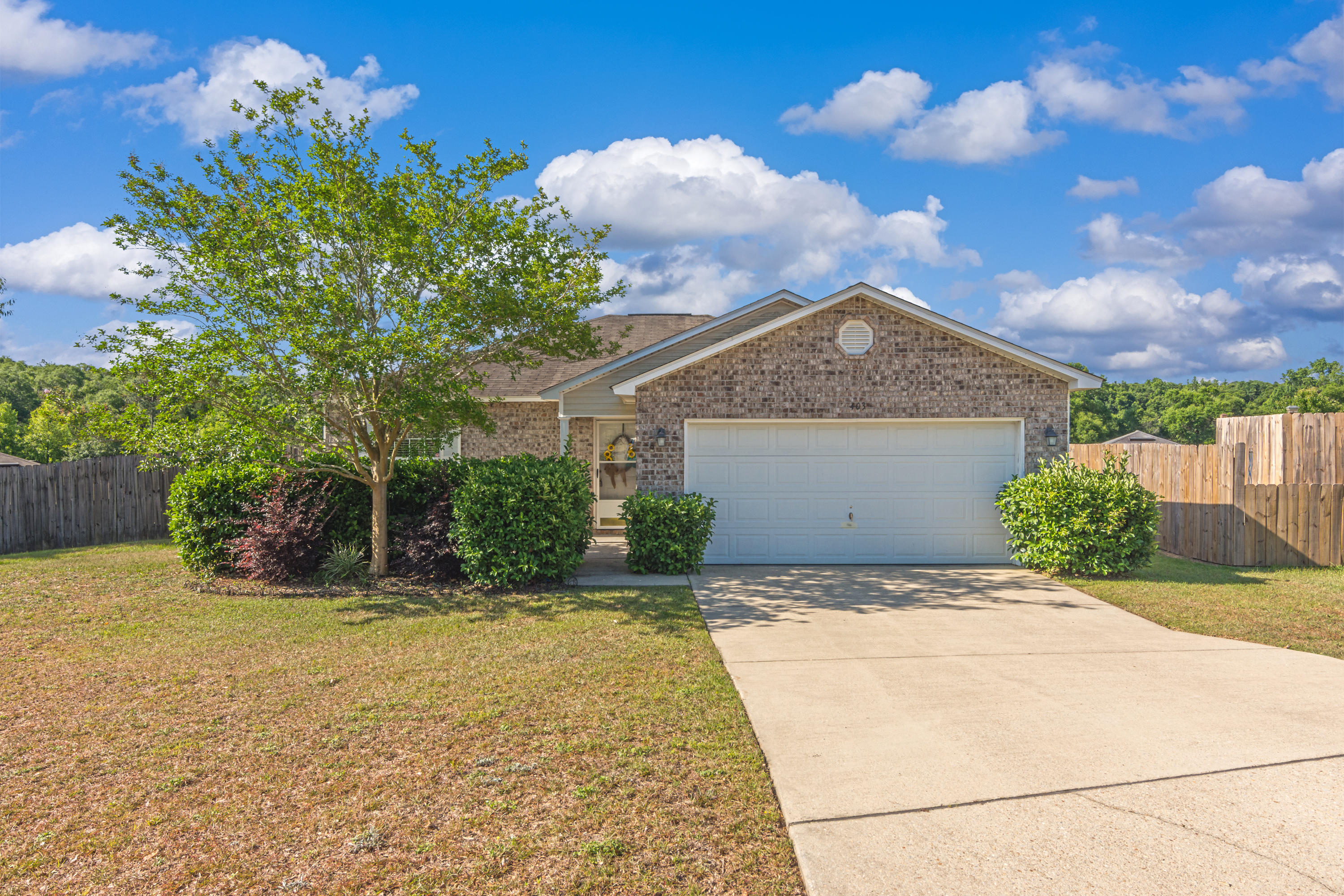You have to see this home! Upon entering you are greeted with an open concept living room, dining room, and kitchen area with vaulted ceilings. There is updated wood plank ceramic tile in the entry and wet areas. All of the appliances convey and there is a pantry in the kitchen. The master bedroom has laminate wood flooring, a walk-in closet, and on-suite bathroom. The other two bedrooms are on the opposite side of the home with carpet that was replaced in 2018. The backyard is fully fenced with a deck that will be updated in May 2020. The home currently has a new American Home Shield warranty and Termite Bond that will be transferred to the new owner. Current survey is available.
