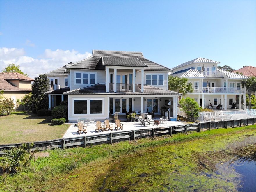 This custom built lakefront home with Guest house and gulf views has 7br, 5 1/2 baths, two full kitchens, three laundry areas, and is located in the exclusive gated community of Destiny East. Double sized lot with 110 of lake frontage provides privacy. The main house consists of 5 br's & 3.5 baths with a separate 1000 square foot guest house with 2br & 2baths and private entrance.. The house was designed to capture lake views from almost every room with expansive outdoor living space and room for a large pool. Recent upgrades include; two new 3 ton a/c, exterior and interior painted,, new carpet in bedrooms, new flooring, brand new porch/decking with outdoor kitchen, new renai hot water heater, new appliances, new lighting, and more. Gross rental projections exceed 160k !