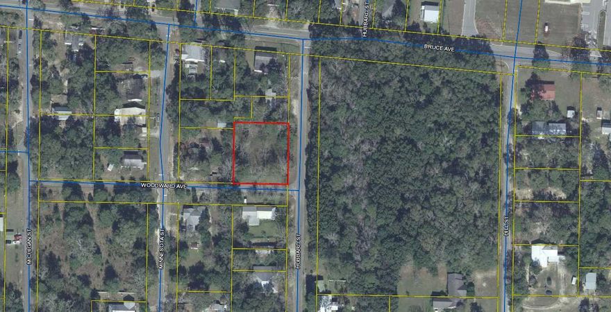 Old homeplace with 2 city lots near Walton Middle School just perfect to build your home in the city and within 3 blocks of DeFuniak Springs Lake Yard. Property is partially chain-link fenced.