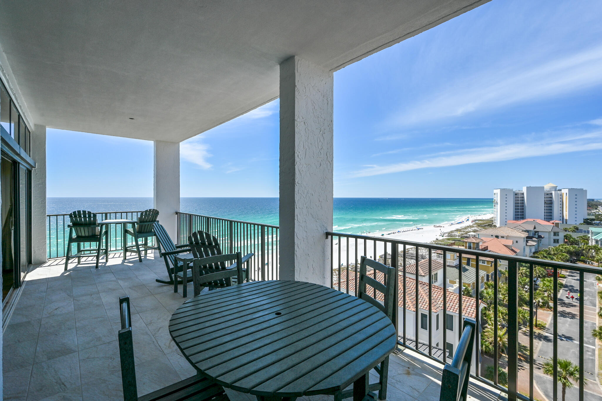 A Jill Doughty design, this gulf-front three-bedroom residence sprawling half of the ninth floor is the epitome of private coastal living. Inspired by the endless horizon and the promise it carries, the recent remodel encompasses an open-concept and a modern-sophisticated flair. Upon initial entry, the grand vestibule leads the way to the foyer showcasing 10' ceilings, aged Oak hardwood flooring, and countless premium finishes that are carried throughout.The expansive main living and dining areas offers sweeping 180-degree views of the turquoise hued waters effectively blurring the line between indoors and out. The gourmet kitchen encompasses custom cabinetry, dual kitchen islands, quartz countertops, and a luxury appliance suite.