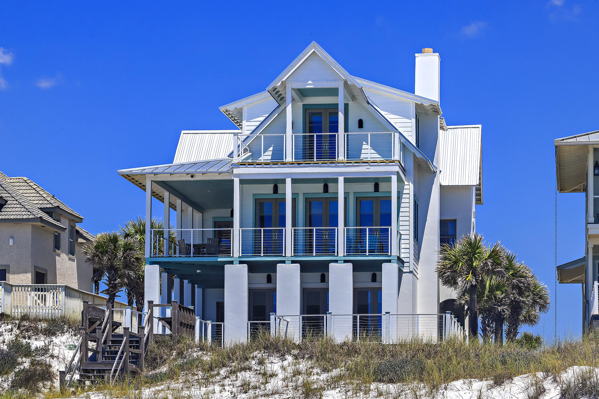 VIEWS, VIEWS, VIEWS!!! Enjoy beautiful, western sunsets on the wraparound balcony of this fabulous home! Take in views of Eastern Lake from the front of the home! Perfectly positioned along the emerald waters of the Gulf, this home provides southwest views going into Destin or enjoy the tranquil waters of Eastern Lake! Meticulously maintained by the current owners, this home has never been rented but could be a wonderful investment opportunity. Built by Davis Dunn Construction, 125 San Roy has all of the features and upgrades that you would expect in a gulf front masterpiece...custom designed interiors, 5 bedrooms, gourmet kitchen, elevator, grand living area with separate ding area, oversized garage, private porch on third level, two baths in Master, concrete construction, and more!