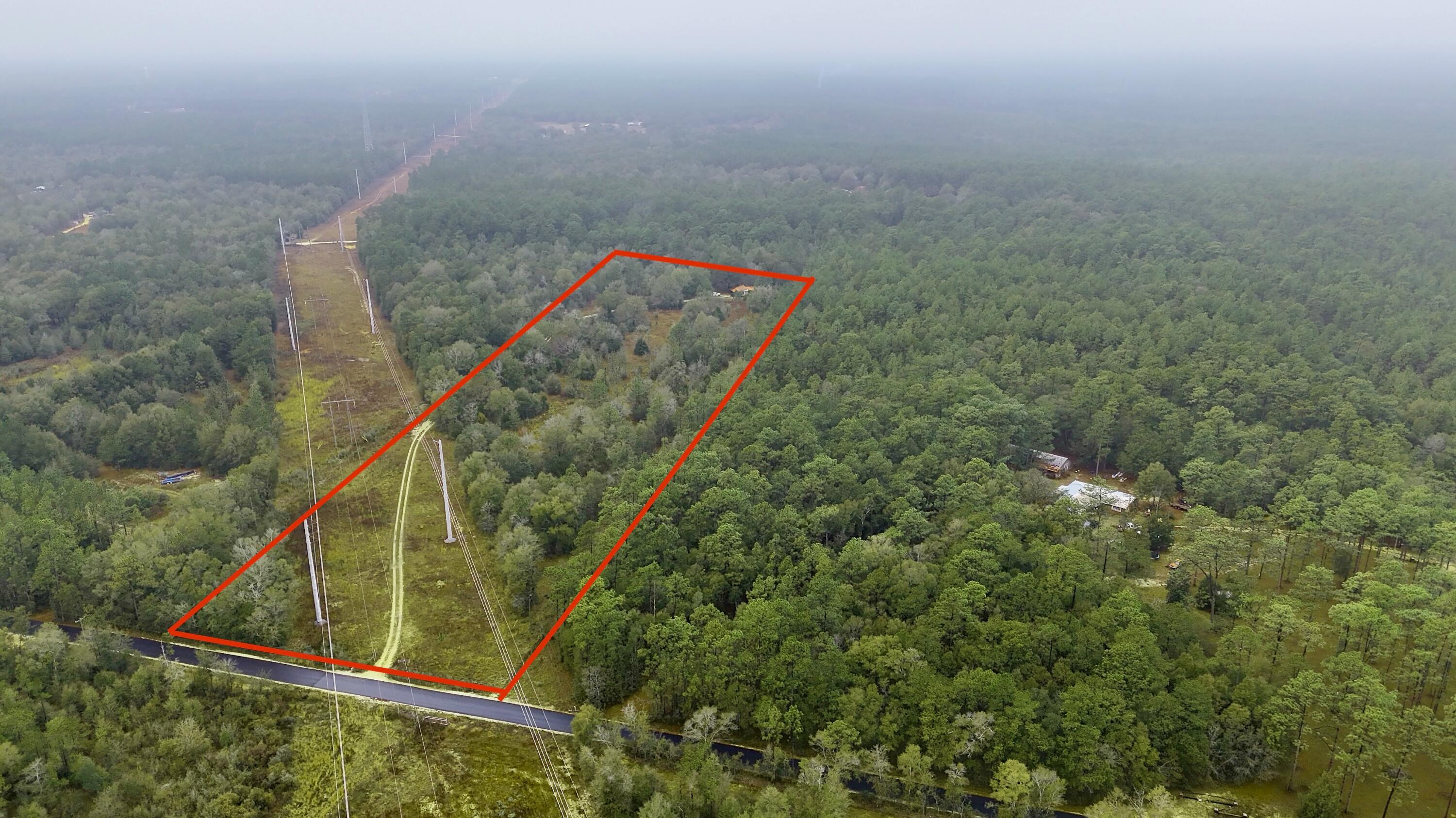 Ready to build your dream home or the perfect hunting camp? This 10-acre property in Holt, FL, is perfect for you! Located minutes from Bryant bridge, across the street from Blackwater State Forest and a short ride to boat and kayak launches. Kelly Mill Rd is all smooth blacktop so no wear and tear on your vehicle. Power is already run to the property, water and septic are on site as well. Cabin on the property has been used as a tack room/apartment and is AS-IS. It's a little piece of Florida, just for you! Buyer to verify all pertinent information.