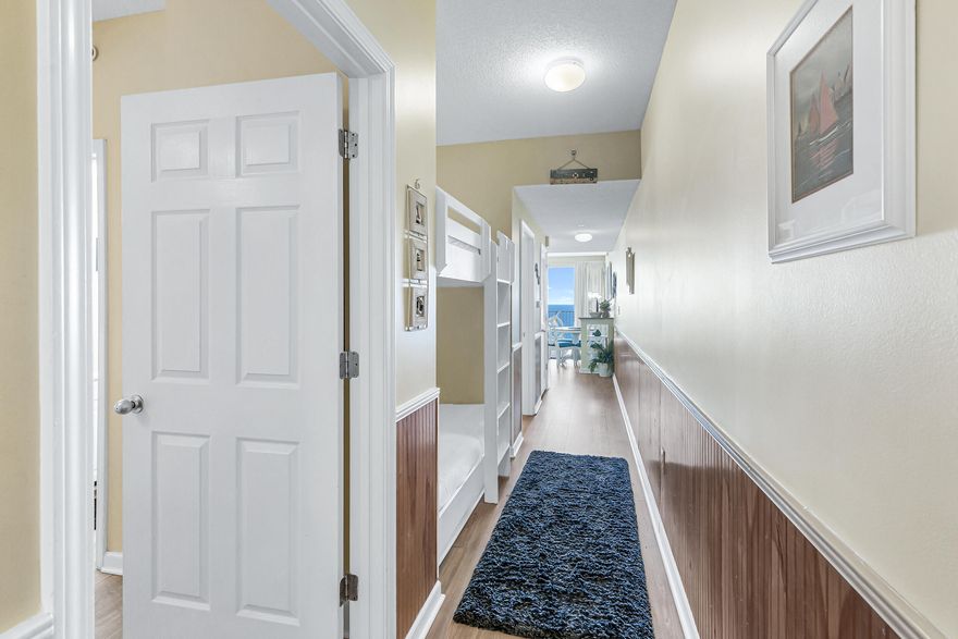 Make this beachy condo yours! This 1 bedr/2 bath with bunkbeds in the hallway comes with a stunning, panoramic, unobstructed view of the beach and Gulf of Mexico. The condo offers you everything you need to be able to relax and enjoy living in Florida. It is very well decorated with close attention to details. Nothing has been left out.  Other features are: NO carpet, granite kitchen counter tops, turn key ready, located conveniently close to elevator. Projected income $50-60K. Majestic Sun amenities include heated indoor/outdoor pool, hot tub, fitness center, parking garage, and is located within the gated golf course community of Seascape. Resort has 18 hole golf course, swimming pool, tennis, many on site restaurants, PLUS 2000 feet of snow white beaches. Call before it is gone!