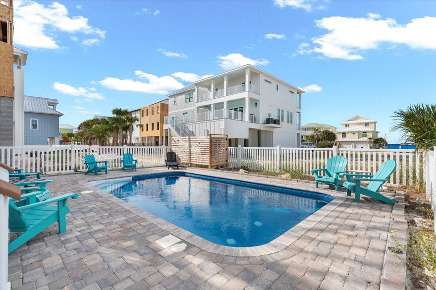 Now available at a reduced price! Cottage by the Sea! One block from the pristine shores of the Gulf of Mexico, this stunning 2-bedroom, 2-bathroom single-family home is a rare find in the sought-after family friendly Navarre Beach community. From the moment you arrive, you'll be captivated by the blend of coastal charm and modern luxury that defines this property.  The open-concept living area welcomes you with an abundance of natural light. Modern coastal decor, LVP floors, fully equipped kitchen with quartzite countertops, soft closed cabinets and matching stainless appliances. The main suite with an en-suite bathroom and access to a balcony where you can enjoy your morning coffee. The 2nd bedroom offers comfortable space for guests with access to the balcony. Bathrooms have been remodeled and updated with modern fixtures, vanities, and beautiful tile work in the large walk-in showers. Dive into paradise with your own private inground pool. Perfect for cooling off on hot summer days, hosting poolside gatherings, or simply enjoying a peaceful swim. Whether you're seeking a year-round residence, vacation retreat, or investment property, this Navarre Beach home offers it all. Experience the magic of coastal living, just steps from the Gulf of Mexico. Call for an appointment to view.