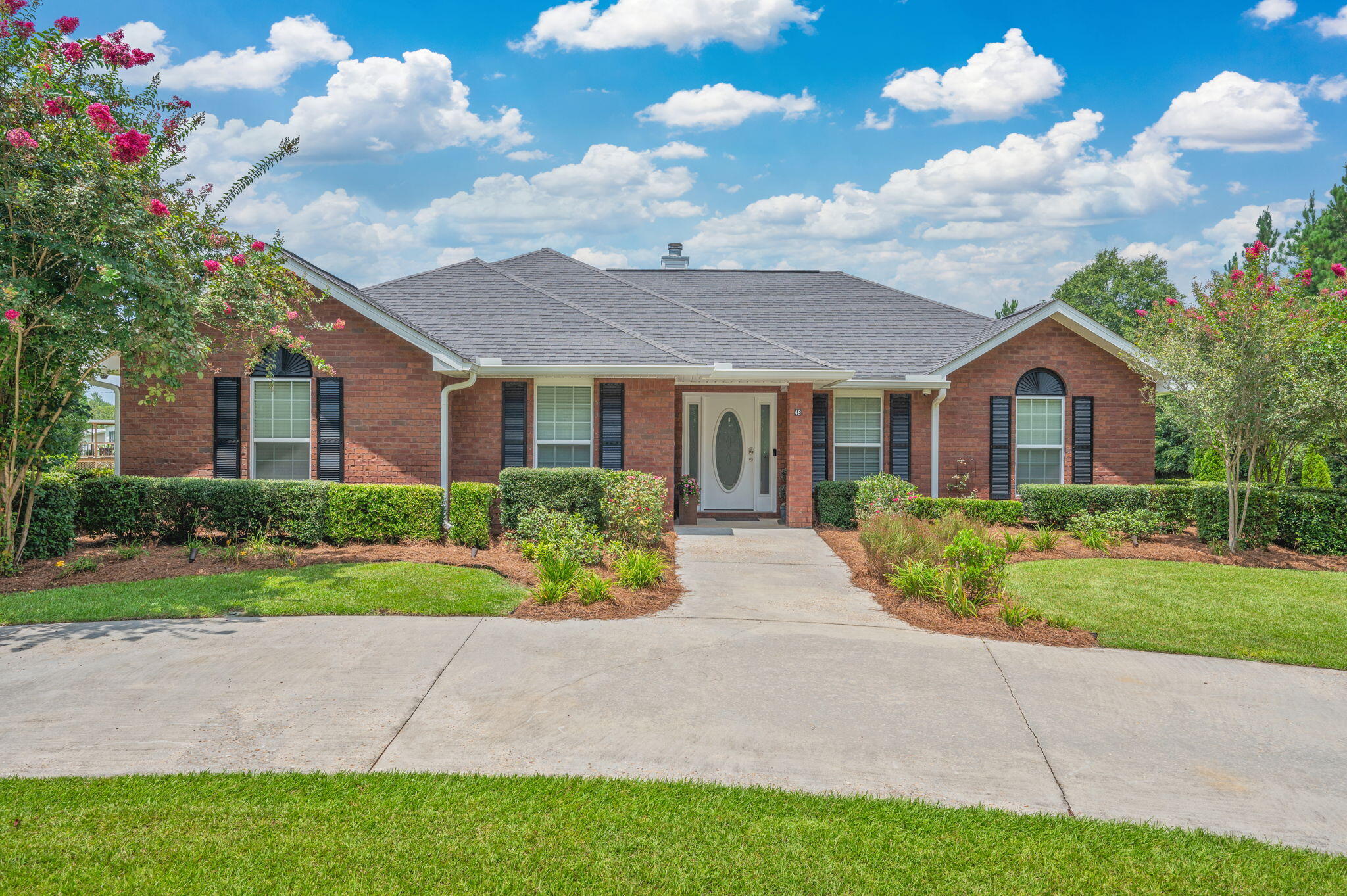 Located in North Walton County in the Paxton School District, this 4BR 2BA brick home sits on 6 plus acres including an inground pool and pool house that includes a bathroom and outdoor kitchen area! Built in 2014 this well-maintained home offers a large open living with a great fireplace and connects to a large kitchen and dining room that is perfect for entertaining and family time. The master suite offers large walk in his and her closets, double vanity, and separate shower. The additional 3 bedrooms are perfect for any size family as well. The property includes a large storage building, 4 car covered carport, irrigation throughout the yard, and paved driveway. The property offers woods to maintain privacy as well as plenty of room to enjoy outdoor living in town. Call to see this one!
