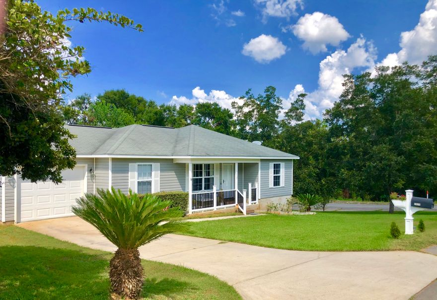 Charming home, well kept, and move-in ready! 3 bedroom/2 bath home on a large corner lot with Garage! Master suite is big enough for a king-size bed, plus has a walk-in closet. Spacious 2nd and 3rd bedrooms have roomy closets. New flooring has been installed in guest bathroom and bedroom (and will be installed in master bath also). All major appliances included: Washer, Dryer, Dishwasher, Microwave, and New Stainless Steel Refrigerator with ice maker! Other features include security system, smart thermostat, water softener, and garage remote control. Easy maintenance exterior vinyl siding has been freshly pressure-washed. 2 porches have been added in the front and back. Landscaping includes pecan trees and sego palms! Perfect for first time buyers, small families, and investors.