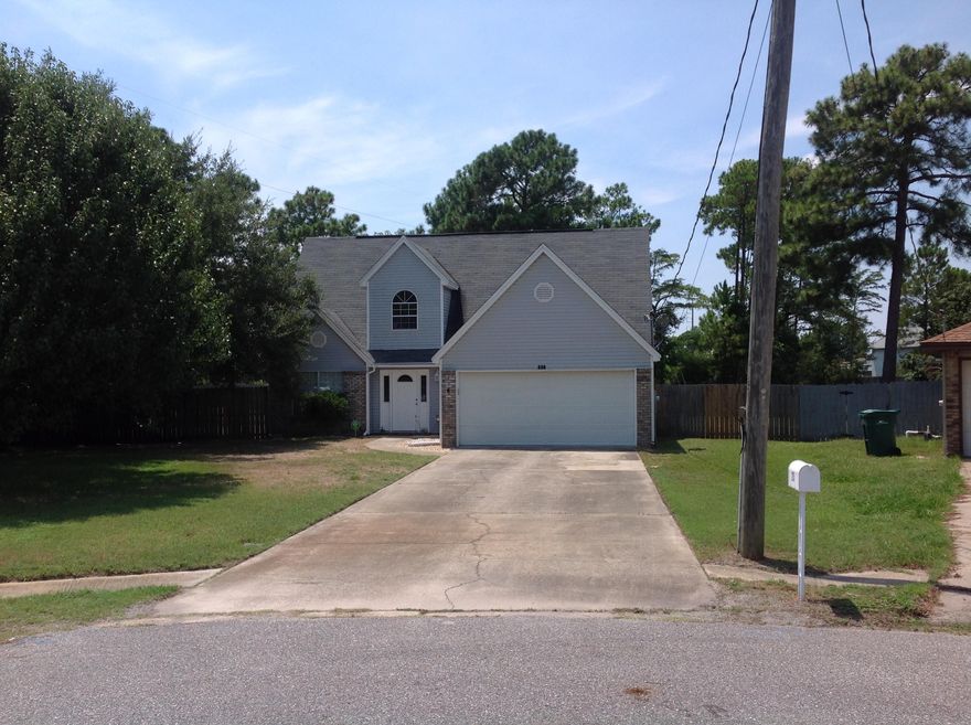 NEWLY RENOVATED! New Kitchen, new Master bath, new Tile throughout on main floor. Fresh paint throughout inside with upgraded mirrors and light fixtures. Just West of Hurlburt Field this Large 2 story 4 Bedroom home is perfectly situated for a very short commute to the base. The home has a true split floor plan with 3 bedrooms and a bath upstairs. The Large Master bedroom is on the main floor just off the living room. The Master Bath is nice and open and boasts a double vanity with New Tile countertops, a whirlpool tub and walk in closet. The living room has a vaulted ceiling open to the second floor and a Large wood burning Fireplace giving you a great feeling of space. The Kitchen opens right into the living room with a breakfast bar.