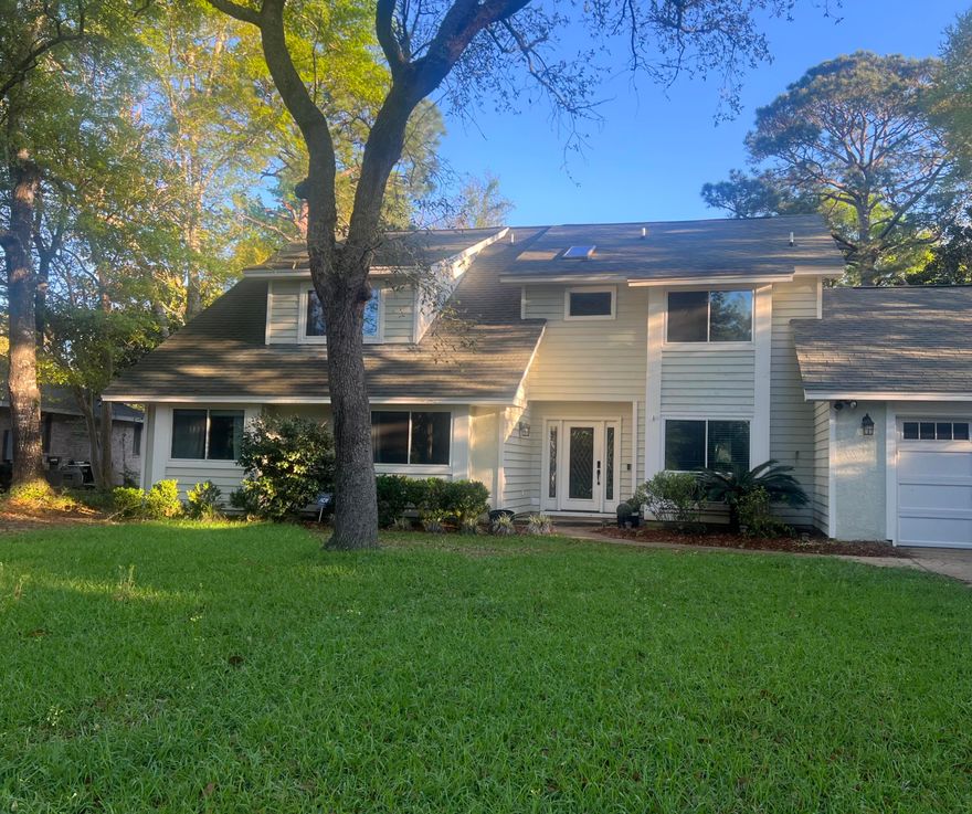 NEW PRICE! LOWEST PRICE GOLF COURSE HOME IN BLUEWATER BAY! No HOA fees! Welcome to this beautiful home that backs up to the 8th tee of the picturesque Bluewater Bay Golf Course!  This home is located in Bluewater Bay, one the area's most sought-after communities. This spacious 4-bedroom bonus loft, 3-bath home offers endless potential in one of the area's most sought-after communities. Set on a generous 0.6-acre lot, the property is surrounded by stunning mature oak trees, creating a peaceful retreat with beautiful views. Inside, you'll find an airy living room with soaring 20-foot ceilings. The master suite boasts cathedral ceilings, a spa-like bathroom with a Jacuzzi tub and separate shower, private balcony, and ample space to unwind.  The master suite and bonus loft area are on the 2nd  A third full bath downstairs, located near the kitchen and office, adds extra convenience. The kitchen features a gas stove, ideal for cooking enthusiasts, while a tankless water heater ensures endless hot water for comfort and efficiency. Ample parking is available in the 2-car oversized garage. View the photos to see the extra charm of the beautiful ceilings, bay windows, and balcony. Sit on your spacious outdoor porch overlooking the golf course. An outdoor shed is included for convenient extra storage. Come and enjoy the amenities of Bluewater Bay, a beautiful resort community with golf course, pools, boating, fishing, tennis, a marina, restaurant, sidewalks, and pickleball courts.  And don't forget the beautiful gulf beaches of Destin are only minutes away! This neighborhood is close to top rated schools, shopping, restaurants, as well as the surrounding military bases of Eglin, Duke, and Hulburt Field. Whether you're a golf enthusiast or simply looking for a serene setting with plenty of character, this is an opportunity you won't want to miss!