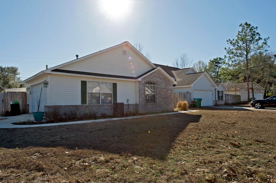 Cute 3 br 2 ba home on a corner lot with 2 car garage.. vaulted ceiling in living room, open layout with lots of natural lighting in dining area...Floors are wood laminate and tile throughout...Screened in porch great from entertaining, nice backyard with shed...home is located near hospital and shopping...Roof was replaced in 2012 and Hot water heater replaced in 2014