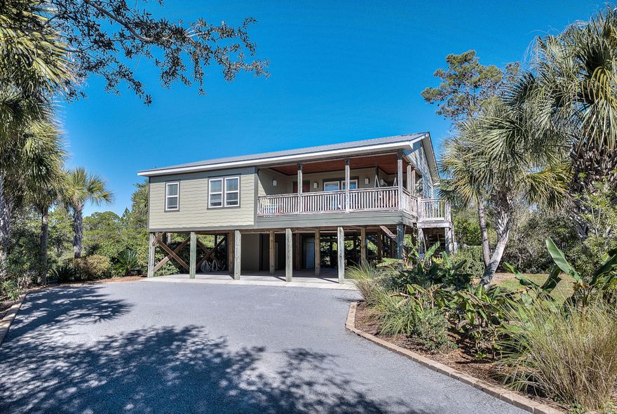 This beautiful recently painted and well maintained beach home is located in the Pines of Blue Beach on a -1/2 acre lot one street off 30A, it is private but close to the beach and minutes to Seaside, Grayton Beach or Gulf Place This 3 bed 2 bath home features Australian cypress wood floors throughout, travertine tile, GE stainless appliances, granite countertops, accent lighting, 9-foot ceilings, crown molding, trey ceiling in living room, and split bedroom floor plan with nice open living area. Enjoy the outdoors with lots of deck area... the oversized front deck stays shaded most of the day and always offers a breeze. There is plenty of parking with covered parking for vehicles, a golf cart or a boat, plus roomy workshop/storage building for bikes, etc. Back yard is partially fenced, per