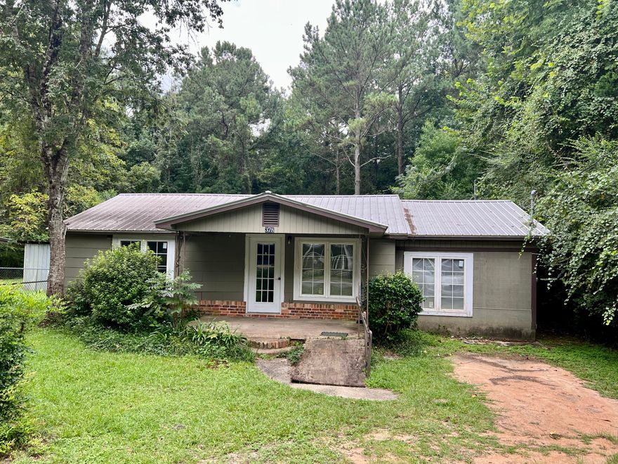 Rare opportunity to purchase a home well under $100k! Located inside the city limits, this home needs some TLC...but would make a great home with just a little effort! Currently serving as a 2 bedroom, a 3 bedroom would be easy in the converted garage just by adding a closet. Lot size is on the smaller side at .17 ac for easy maintenance. Could make a nice home as well as a money-making rental that is estimated at 10%+ ROI per current rental rates and HUD housing rates & guidelines.