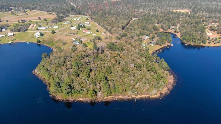 Live like a King on the last large acreage parcel available on King Lake. This 17+/- acres has 1716+/- of Waterfront feet. Current zoning is Rural Village, allowing two homes per acre which would make this the perfect place for development. There is a main home and guest home on this property. Value is in the land. Also included is large detached garage. Enjoy beautiful sunsets from this parcel. Property has mature magnolia and oak trees. It is simply beautiful. Owner will consider owner financing and potential joint ventures. Property shown by appointment only. Call for your tour today!