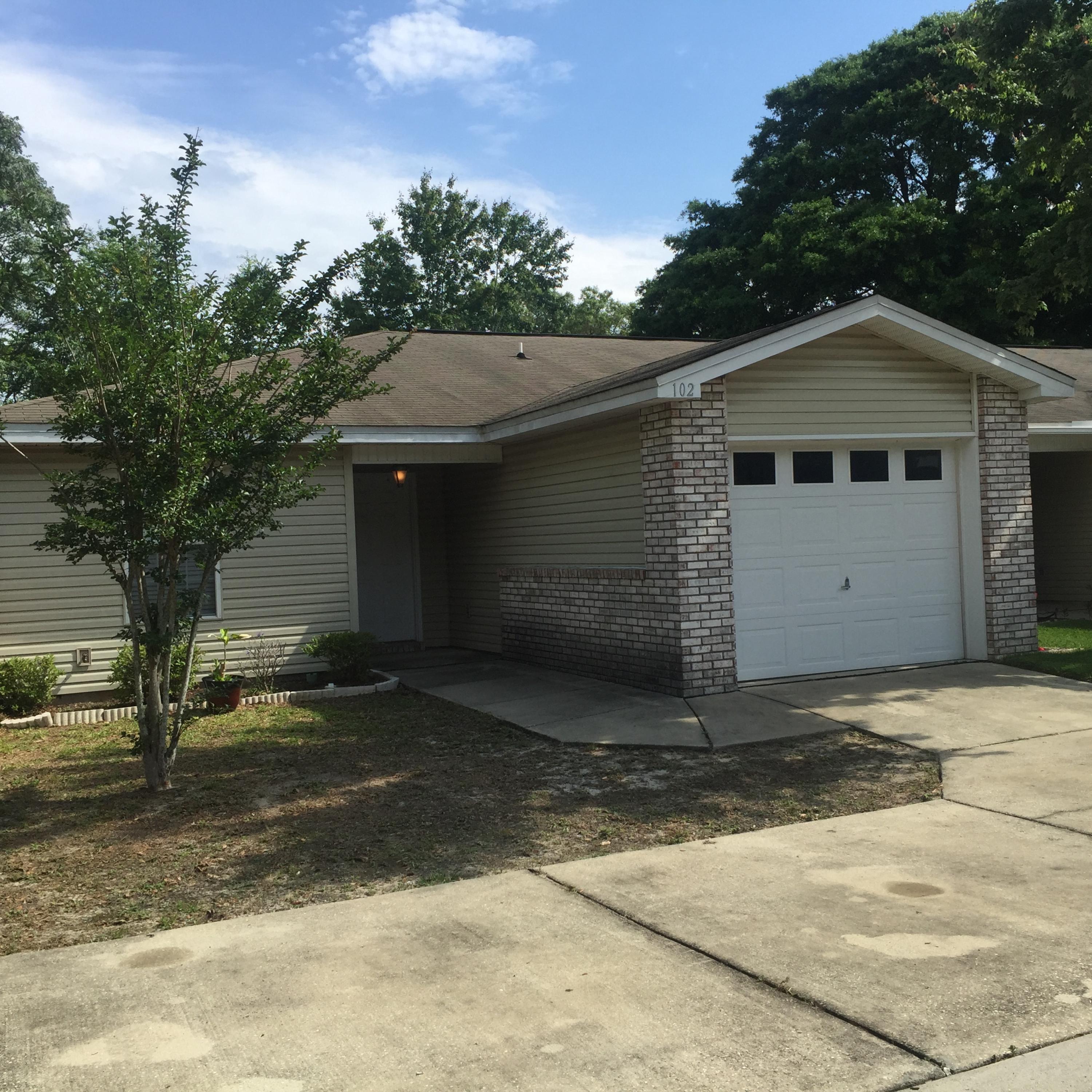 Nice well maintained townhome,with Garage and a large backyard.