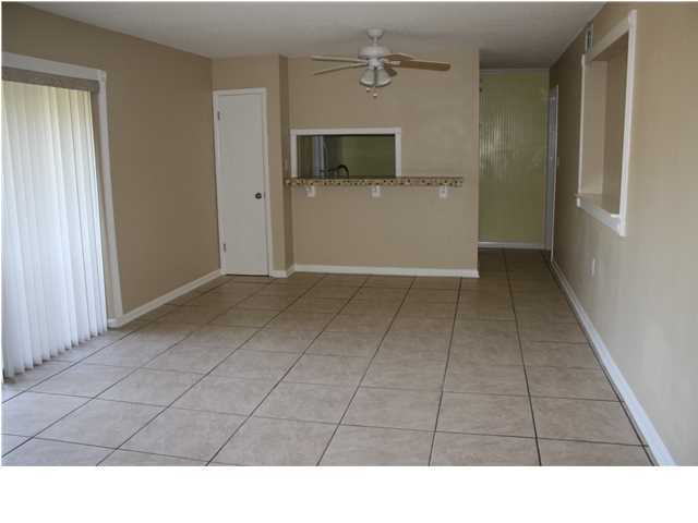 The 2 bedroom, 2 full bath is beautiful! The large living room tiled and had glass sliding doors to porch area. The kitchen has tiled bar, electric stove/oven, built in microwave, and fridge with ice maker. The two bedrooms are very large and also feature tile and neutral walls. Both bathrooms have recently been redone, with new cabinets, vanities, mirrors, lights, linen closet and tile floors. There is a separate laundry room for this unit and washer and dryer are included. The new ac unit keeps your electric costs to a minimum. The complex features a pool and tennis courts. Water, sewer, and garbage is included in the rent.