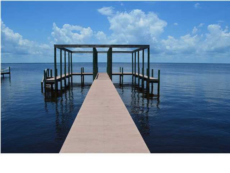 INCREDIBLE homesite DIRECTLY ON THE BAY in Miramar Beach! This gem is located on Crest Drive, a quiet no through street dotted with exceptional and cohesive styles of upscale homes without the mandates of a homeowners association. Lot is cleared, prepped and includes seawall with extra rip rap. Lot features dock with 2 large boat slips and Timbertek virgin plastic decking. Crest Drive is minutes by boat to Sandestin's Village at Baytowne Wharf or a casual ride to Crab Island, the Harbor and the Gulf of Mexico. **If you are looking for Bayfront, you need to view this property!**