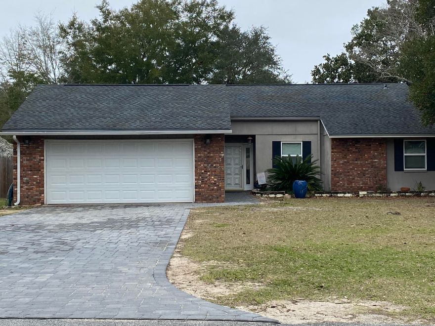 Must see Bluewater Bay beauty!! Large 3 bedroom, 2 bath home located in the heart of Bluewater Bay.Almost 2000 square feet. Renovated to include newer bathrooms, upgraded stainless steel French door fridge, stainless steel slide in stove, stainless steel dishwasher, granite countertops, tile flooring with LVP in bedrooms and bonus room. No carpet in the home. Soaring ceiling in great room. Interior laundry room with utility sink,  fenced yard 2019, separate dining room, brick fireplace and 2 car garage with attic storage. New hurricane rated garage door 2018. New paver driveway. Dogs are welcome with a $300 non refundable pet deposit based on non aggressive breeds. No smoking, no cats. Schools are Bluewater Elementary, Ruckel Middle School and Niceville High School.