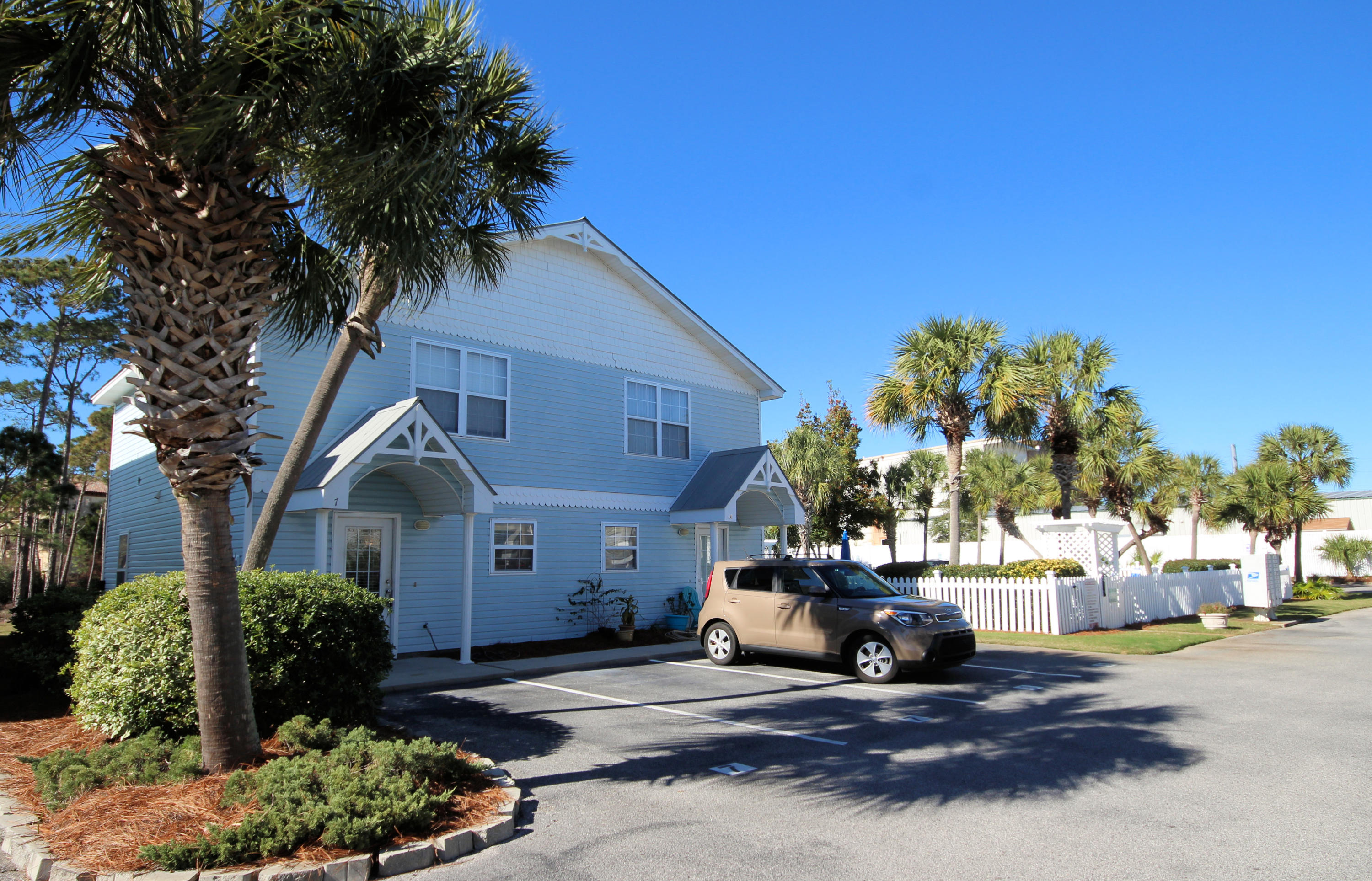 What a location! Short distance from the Gulf of Mexico beaches, this townhouse is located on Scenic Gulf Drive, convenient to shopping and restaurants. Ideal primary residence, investment or short term vacation rental. Each bedroom upstairs has a full bath and laundry centrally located. Open floor plan with breakfast bar, tile flooring throughout first floor, half bath on first floor and sliding doors lead to a screened in porch. Back overlooks a pond. Sparkling community pool nearby and two assigned parking spaces directly in front of unit for convenience. End unit with window in living area for natural light.