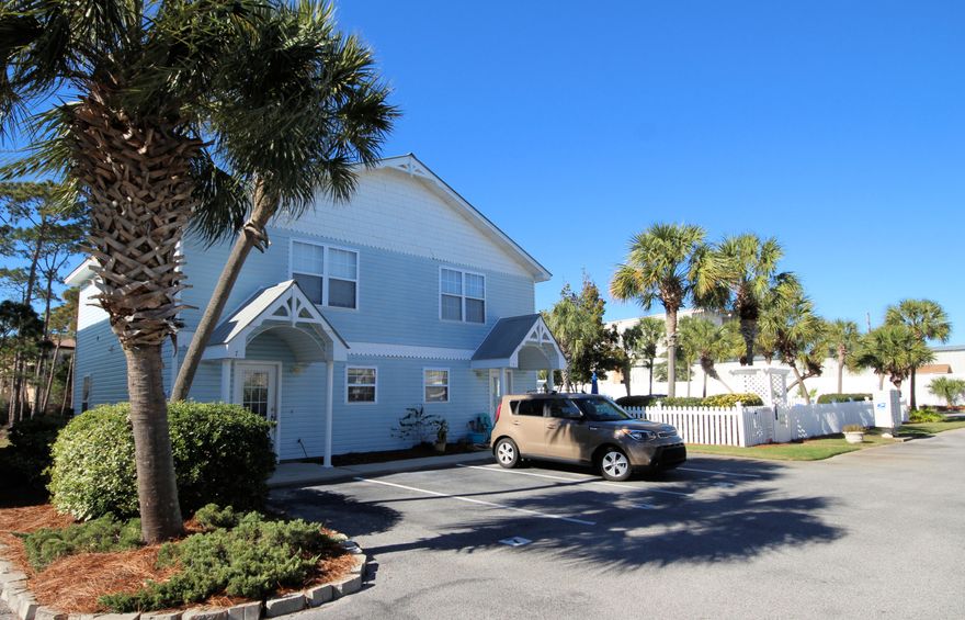 What a location! Short distance from the Gulf of Mexico beaches, this townhouse is located on Scenic Gulf Drive, convenient to shopping and restaurants. Ideal primary residence, investment or short term vacation rental. Each bedroom upstairs has a full bath and laundry centrally located. Open floor plan with breakfast bar, tile flooring throughout first floor, half bath on first floor and sliding doors lead to a screened in porch. Back overlooks a pond. Sparkling community pool nearby and two assigned parking spaces directly in front of unit for convenience. End unit with window in living area for natural light.