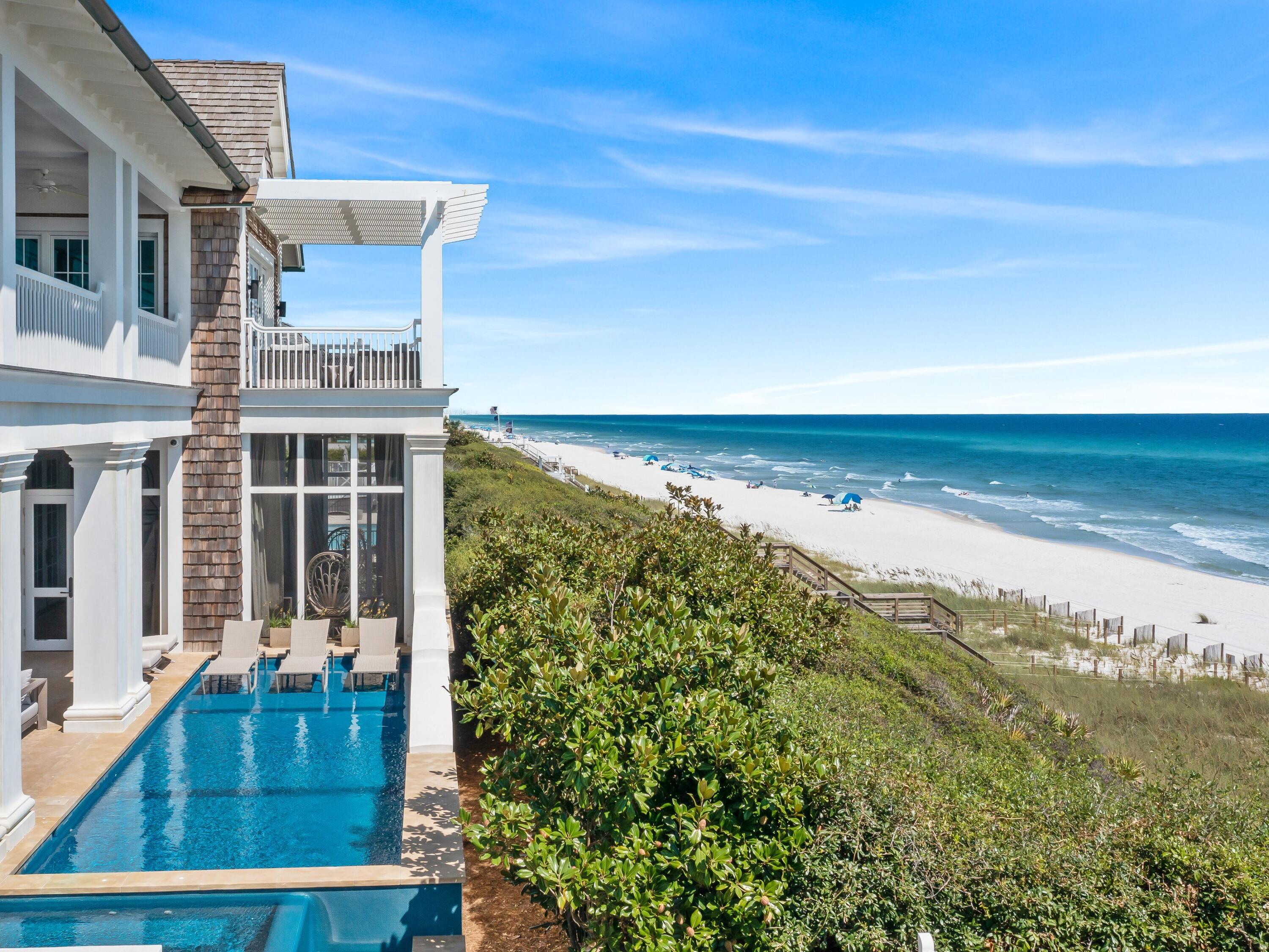 Just steps from the crystalline waters of the Gulf of Mexico, this remarkable residence perched above the dunes demonstrates perfect harmony between modern elegance and old-world charm. Every aspect of this home, created by Geoff Chick, strikes notes that reflect its picturesque surroundings -- from its sturdy all-concrete construction to cedar shake siding that dovetails with nature.