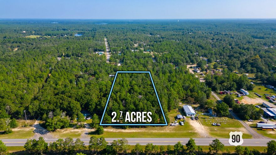 2.7 acres of vacant wooded land with so many possibilities. Zoned Rural Village allowing up to 4 single family dwellings to be built. There are no restrictions or HOA to abide by. No utilities are currently present. However City of DeFuniak Springs does provide public water to this area. Tap fee has not been paid. There is power at the road & a septic system will be needed. Located less than 2 miles out of town on Highway 90 West. Minutes from downtown Defuniak Springs where several of the town's best restaurants & shopping are located. 45 minutes from the most beautiful beaches on the Emerald Coast.