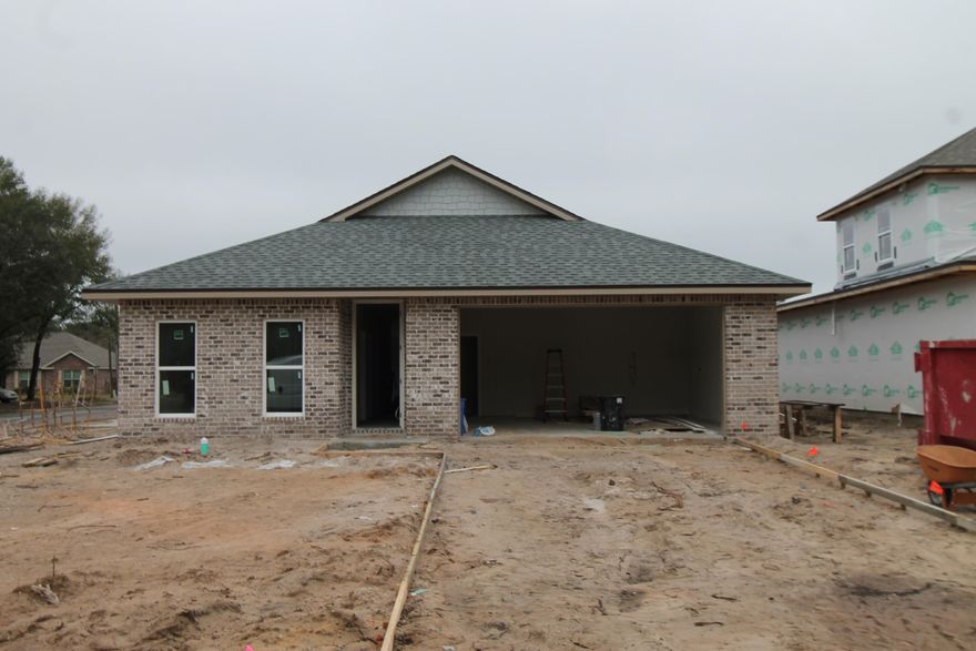 Introducing ''Temple Park at Port Dixie'', a 40 lot development is Shalimar with both underground utilities and broad sidewalks. This 4BR/3BA, 2CG custom brick homesite has 10 Ft. ceilings w/ impressive crown molding, LVP flooring throughout most of the home, tile in the master bath, and 5 1/4'' baseboard throughout. Kitchen boasts custom painted Bisque cabinetry, granite countertops, a large pantry, and stainless appliances (including an oversized commercial grade refrigerator/ freezer). Master suite is in the left rear of the home, is very roomy, has 2 large walk - in closets, a marble walk - in shower with glass enclosure, a whirlpool garden tub and double vanity.