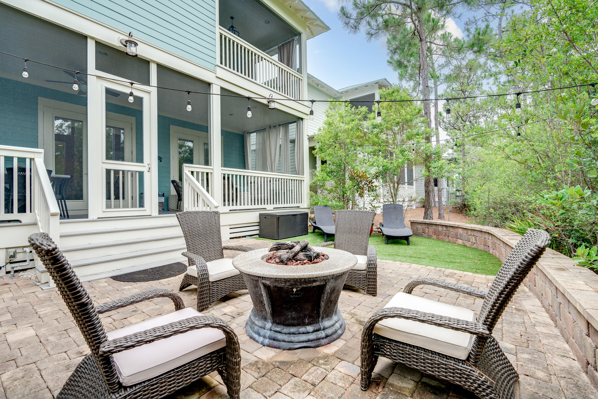 Welcome to this amazing beach chic home located in the highly sought-after NatureWalk at Seagrove neighborhood! If you're looking for the perfect blend of comfort, style, and entertainment, then this is the place for you. Situated on the closest street to the beach, this home boasts one of the most popular open floor plans. What sets it apart is its larger lot size, allowing for a truly magnificent backyard. The custom design is a one-of-a-kind masterpiece, ideal for hosting gatherings and creating lasting memories. Step outside and be greeted by a built in grill, a fire pit table, a spacious paver patio, and even turf grass. All of this is framed by beautiful landscaping, with the added bonus of a private view overlooking the tranquil preserve.
