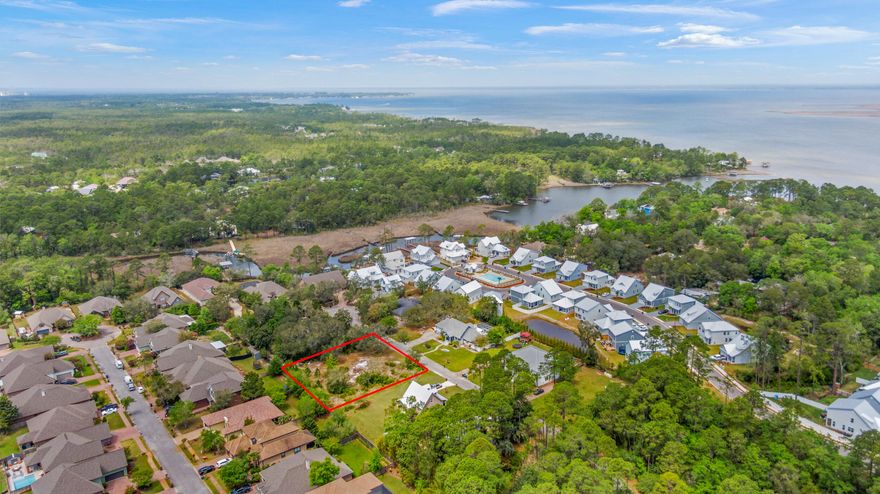Large, cleared lot in the established neighborhood of River Bend.  Build your dream home and enjoy all the conveniences of Grand Boulevard, Sandestin and 30a such as shopping and fine dining as well as weekly farmers markets, events and fun family outings. The beautiful beaches of South Walton are just minutes away!