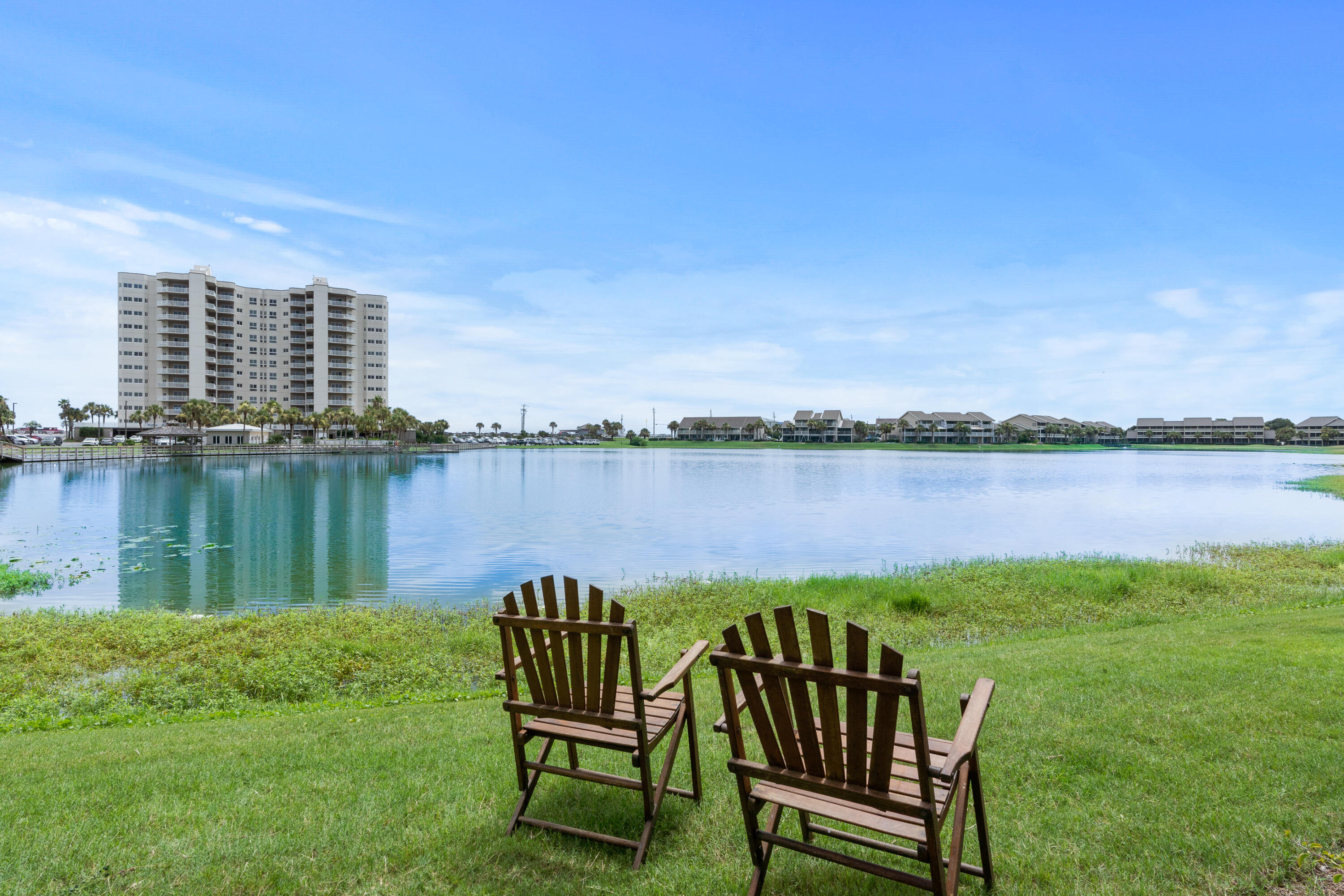 Welcome to your stunning waterfront retreat.The unit's southern exposure bathes the space in natural light, accentuating the elegant LVP floors and recessed lighting. The living room windows are adorned with motorized blinds for added convenience.The open kitchen boasts quartz countertops and backsplash, stainless steel appliances, and a pantry for ample storage. Additionally, the unit features a washer/dryer for added convenience.Step outside to enjoy the communal heated pool or relax on your private porch with tranquil water views. The complex offers top-notch amenities, including a basketball court, tennis court, and an on-site restaurant for your enjoyment.For peace of mind, the property is equipped with a security gate, ensuring privacy and security. The community also features clay tennis courts, pickleball courts, 5 swimming pools, and a basketball court.
Located in a prime waterfront community, this condo is perfect for those seeking a serene escape with resort-style living. Don't miss this opportunity to indulge in the ultimate coastal lifestyle. Schedule your private tour today and experience the allure of waterfront living at its finest. Seller is a licensed realtor in the state of Florida.