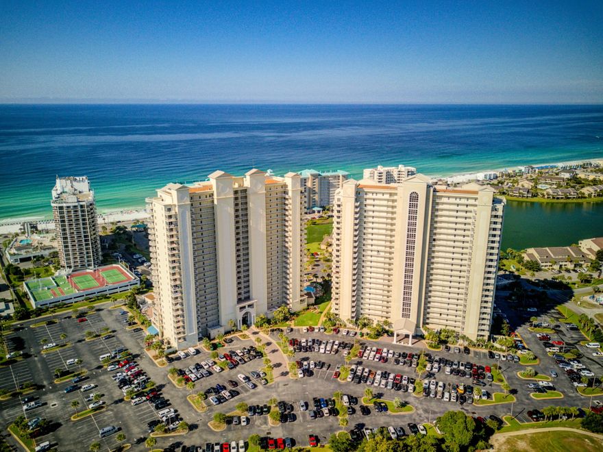 Enjoy great views of the Gulf of Mexico from this attractive 10th floor unit at Ariel Dunes condominiums on beautiful Seascape Resort! This unit offers an open kitchen/dining/living area; a master suite with gulf views and master bath with dual sinks, large soaking tub and separate shower; an additional bedroom with nice views toward the Choctawhatchee Bay; a cozy bunk room, which could be an office for longer-term residents; and full-size laundry! It features 9' ceilings, tile floors, crown molding in the living room, granite countertops, a breakfast bar, stainless appliances, and attractive bowl sinks.Residents and their rental guests have access to two large pools adjoining the building, as well as five other pools on the property. Amenities also include fitness facilities, a
