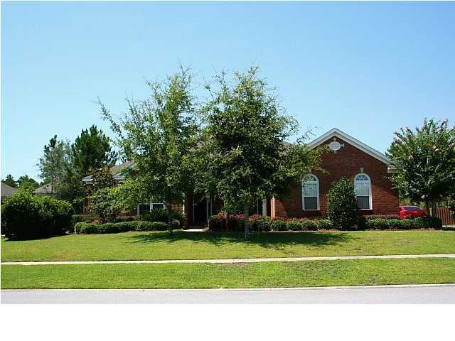 Gorgeous home in Hammock Bay with 300 Sq. Ft. Closed in Florida Room overlooking the well kept fenced in backyard with beautiful landscaping and full yard spinkler system (well). This home features a 3 car garage with 15 ft. of cabinets, workspace, and wall to ceiling storage shelving. Owner Pays HOA fees... basic cable included! The Great Room features a kitchen with granite countertops & stainless appliances, a living room with bricked fireplace, and a breakfast nook! The Florida room is a great space to enjoy sipping on lemonade, reading a great book, and watching the children play in the large fenced in back yard. Hammock Bay is a fantastic one of a kind family community. Two swimming pools, Lake Club, Bay Club, Fitness Facility, $250K playground, and 12 miles of hiking trails.