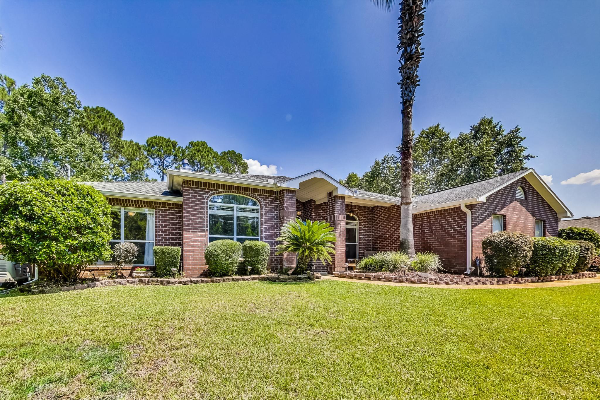 Assumable low 2.5% interest rate for qualified buyers! Perfect family home near Hurlburt Field, schools, shopping and the Beach! Beautiful, recently updated 4/2 with HUGE heated/cooled Florida Room! Anti-virus HVAC filter system, full gutter system, and Whole home Generac generator for peace of mind!Split floor plan with an additional flex space/office, formal dining room, living room, gourmet kitchen with granite counters, upgraded slow close cabinetry and prep sink in island! Home boasts a very large master suite and 3 additional great sized bedrooms, as well as a spacious fenced back yard and sprinkler pump well for no additional water costs to offer a special place to call home. Enjoy Holley by the Sea Rec Center with 3 pools, tennis courts, sauna, gym, boat dock and playgrounds!