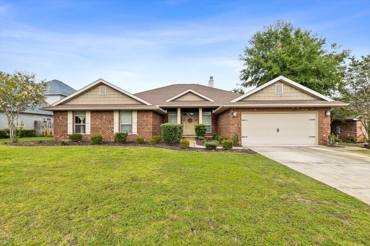 Beautifully maintained former model home brimming with upgrades.Spacious 4-bedroom, 2.5-bath residence offers the perfect blend of elegance, comfort, and functionality.Step inside to find granite countertops throughout, elegant crown molding & a stunning wood-burning fireplace that adds warmth & charm to the living space.Large kitchen features an island, stainless steel appliances & plenty of cabinet space.Primary suite features an en-suite bathroom w/walk-in shower, garden tub, linen closet & dual walk-in closets.Outside enjoy your fully fenced backyard with mature landscaping & a covered patio ideal for relaxing or entertaining year-round.Located on a cul-de-sac w/community sidewalks throughout.Deeded water access & only a 8 min. drive to the beach.Assumable 2.25% VA loan available.