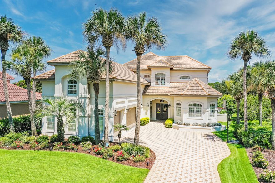 LUXURY LIVING AT ITS BEST...that's the best way to describe this refreshingly updated, lakefront, estate-sized home on the 15th hole in the gated community of Regatta Bay.  As you drive through the cul-de-sac and pull up to this house, you will notice how stunningly beautiful it is with immaculate landscaping, gas lanterns, and a three-car garage.  Upon entering the home through the 8' Mahogany doors, your eyes are drawn past the impeccably finished, open floor plan across the sparkling pool and hot tub to the lake and golf course beyond. This estate-style home has been updated from top to bottom including new AC units, hurricane protection, and full house generator (32kW).  This home has one of the largest pools and best views in all of Regatta Bay.  The main floor features