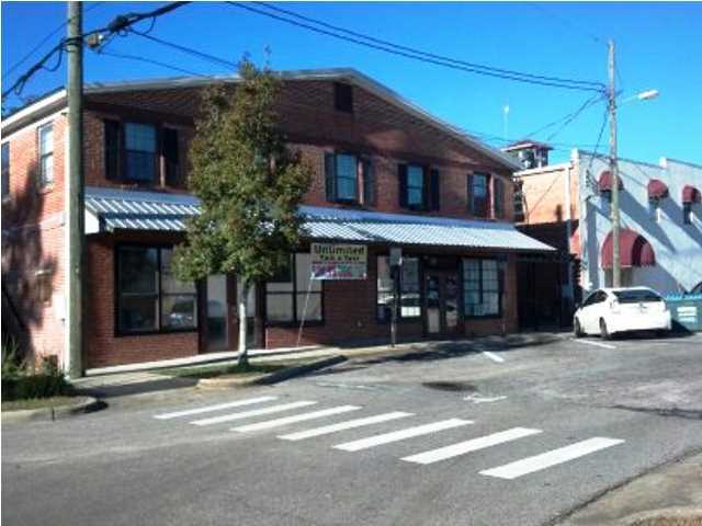 Commercial building with 2 floors. First floor has new sheetrock, paint and ceramic tile, two bath rooms, separate showers and storage areas. The 2nd floor has 12 rooms, wood floors, 3 baths and efficiency kitchen. The building has separate CH&A for each floor and metal roof.