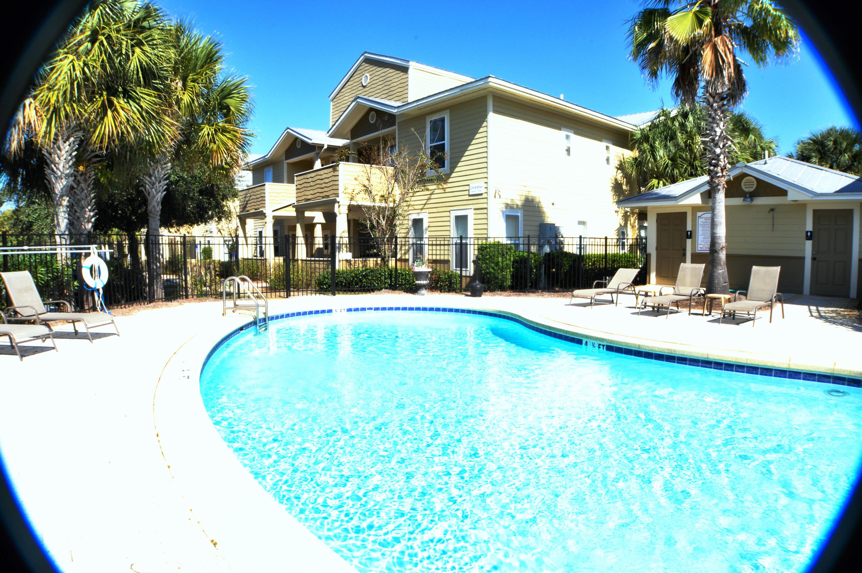 **New AC Unit put in this week 6/12/2019 with 10 yr Warranty** 2 BR 2 BA Condo -- second floor --facing the back. Unfurnished. All the appliances and washer and dryer are included. Kitchen features black granite, real wood cabinets, black appliances, and tan tile. Both bedrooms have light walls and carpet. TopSail Village is near the new Sacred Heart Hospital, Walmart, Publix, Restaurants, and shopping. Beach access is less than a mile away. Pets under 40lbs are allowed.