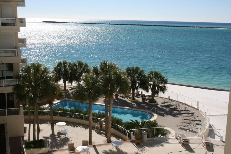 Captivating views of the Gulf of Mexico and the Destin East Pass surround this lovely 3 bedroom, 2 bath condominium at East Pass Towers. An open floor plan welcomes you to beautiful tile flooring leading you to formal living/dining rooms and a wrap-around balcony. A kitchen perfect for entertaining offering stainless appliances, plenty of cabinet space and a breakfast bar. The waterfront master retreat features a spa bath and his & hers vanities. An assigned covered parking space & extra storage add additional value to this unit.