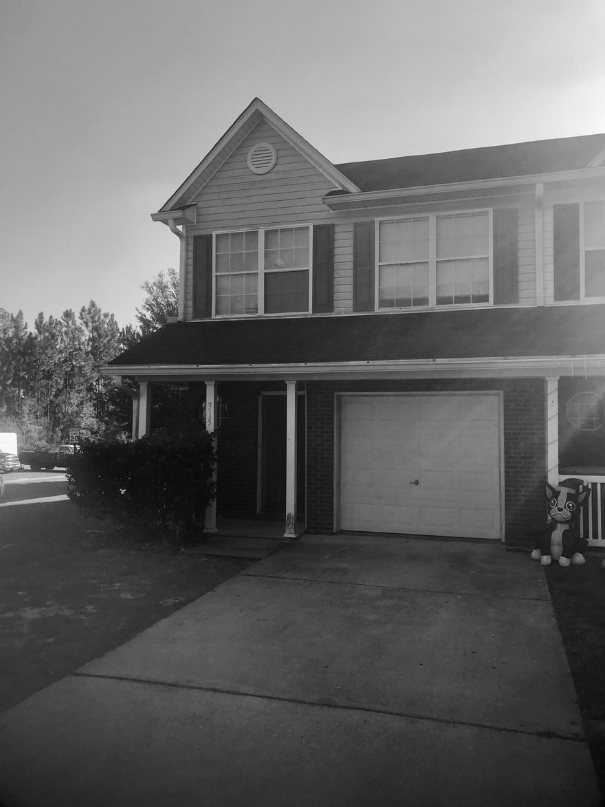 This unit is being sold AS IS. *Available for immediate move-in* Large end-unit 3 bedroom, 2.5 bath townhome.. Downstairs you'll enjoy the open feel of the large living room, dining room, kitchen with breakfast bar, and half bath- making this the perfect space for entertaining. Upstairs you'll find the spacious master bedroom with en-suite, featuring vaulted ceilings and walk-in-closet. Additional two bedrooms located upstairs on the front side of the home along with a second bathroom. Washer/dryer hookups are conveniently located among the bedrooms, making laundry a breeze.Unit needs some updating and care. These are great investment properties that should generate 9% ROI if managed properly.